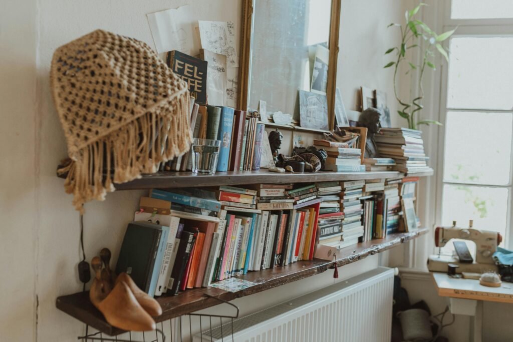 A cozy home library featuring a vintage bookshelf with assorted books and decor items.